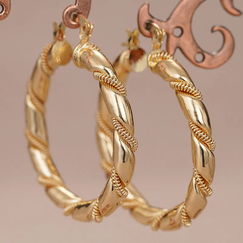 Geometric copper ear clips with ring and line patterns in three golden finish options