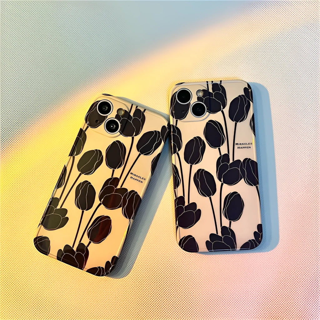 Black silicone iPhone case featuring a printed tulip flower design on the back.