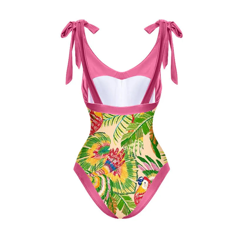 Pink floral print women's V-neck one-piece swimsuit with a thin skirt.
