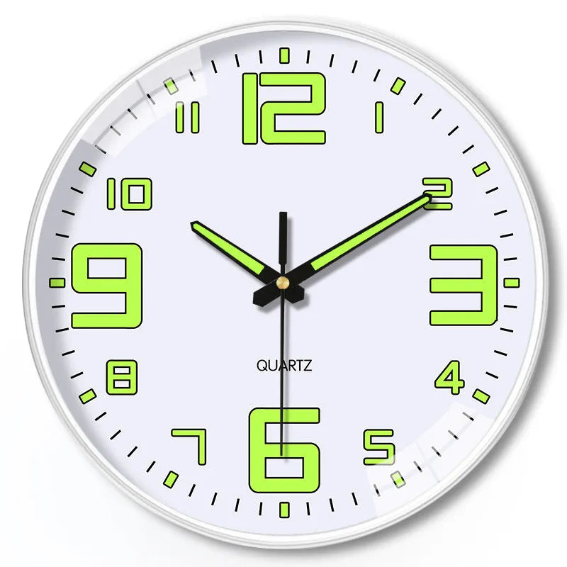 Modern 8-inch luminous wall clock with white plastic case on a wall.