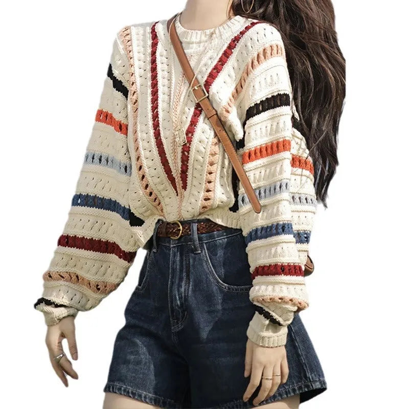 Round neck pullover sweater with rainbow stripes in hollow knit design featuring batwing sleeves