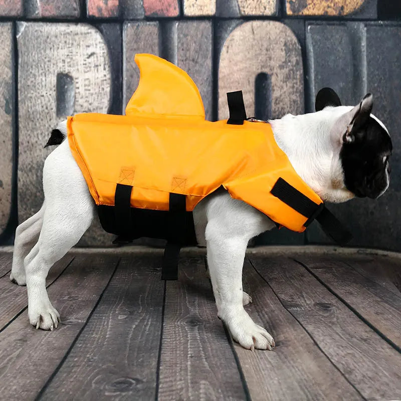 Shark-shaped dog life vest in blue or orange, cloth pet life jacket with buckle, sizes XS to XXL.