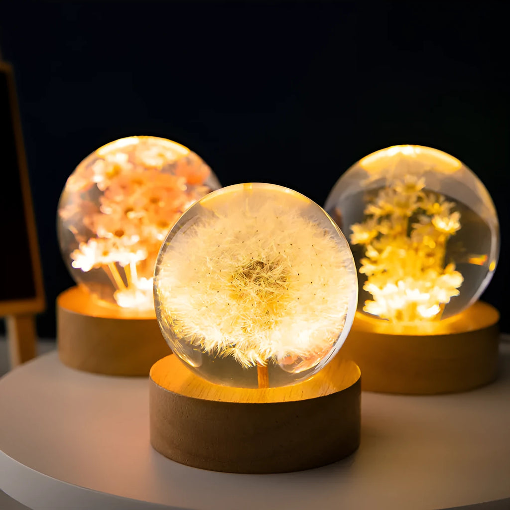 Dandelion preserved flower inside clear resin crystal ball on beech wood stand, functioning as a USB night light.