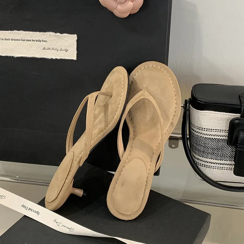 Women's round toe stiletto flip-flop sandals in black and camel colours on a rubber sole.