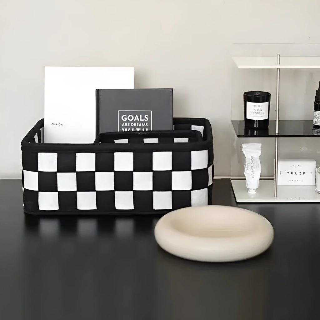 Checkerboard patterned grey felt folding storage basket shown upright and collapsed flat.