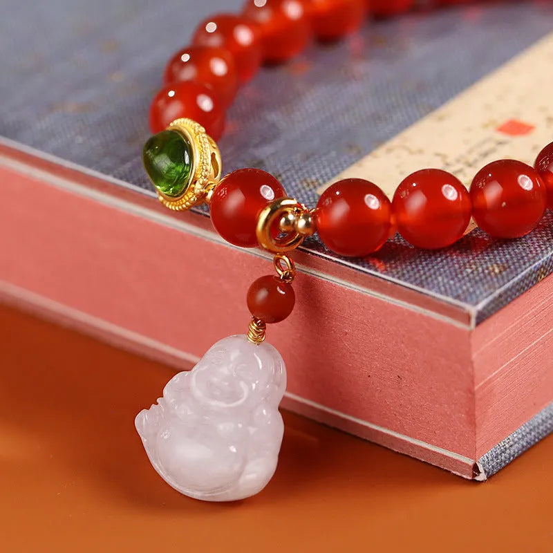 Handmade red agate bracelet with geometric Chinese design featuring Maitreya Buddha jade pendant and ancient gold elements