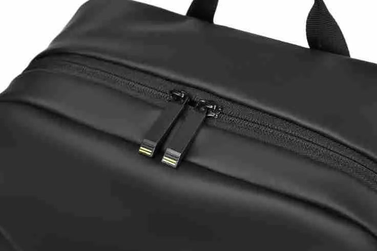 Large waterproof backpack in PU leather available in black, blue, or grey colours