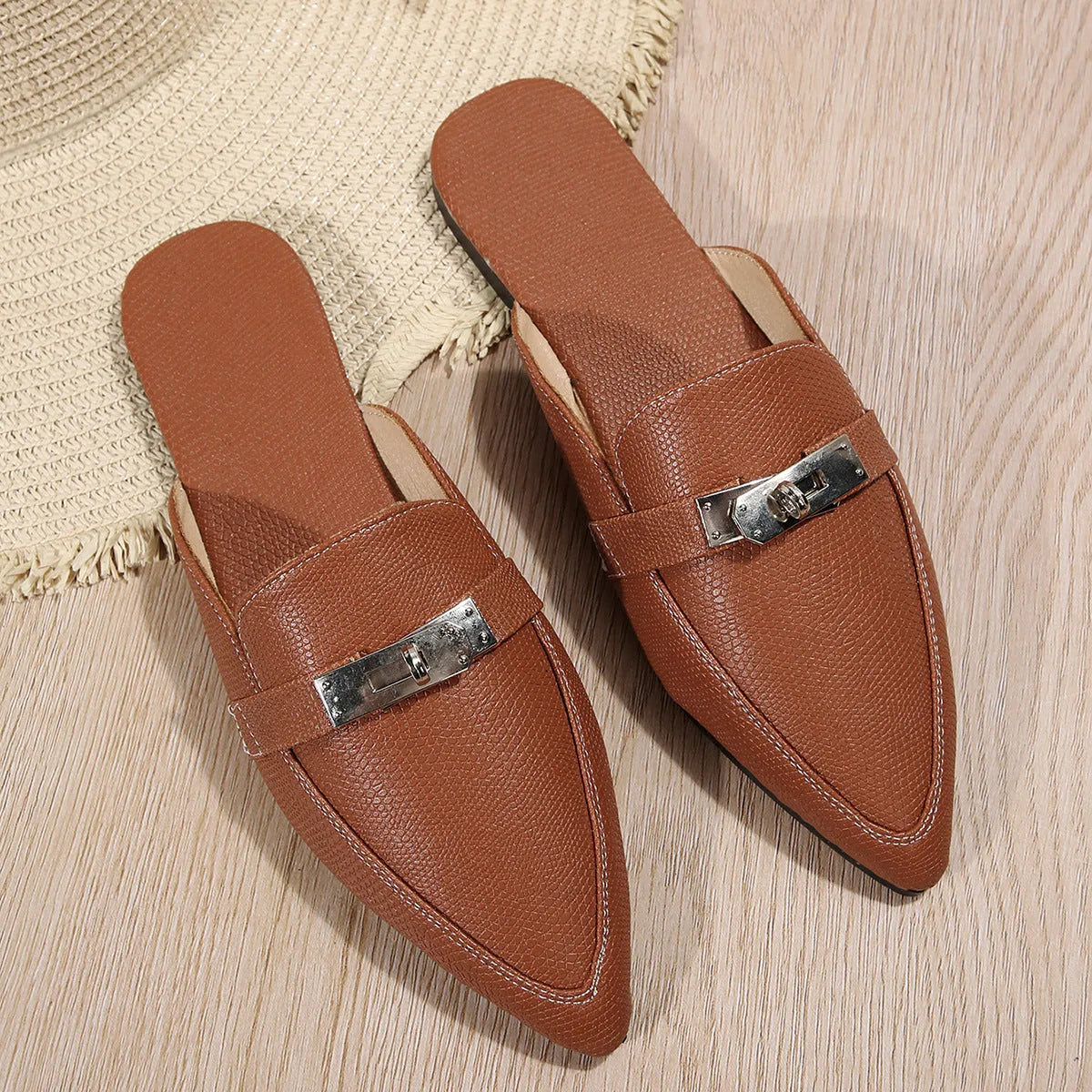 Light brown women's pointed-toe low heel semi-slippers on a white background