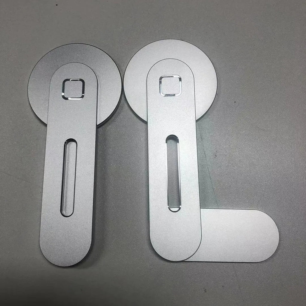 Aluminium magnetic desktop expansion bracket for laptops in black, showing fine sandblasted finish and compact size.