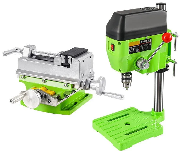Mini bench drill and milling machine on a workbench with cross bench pliers.