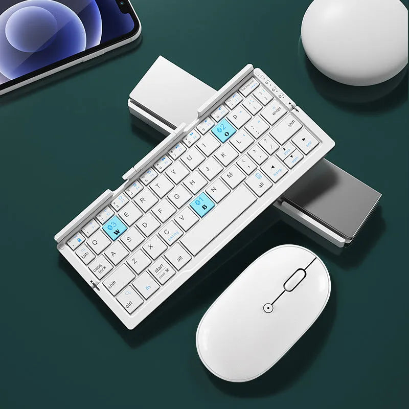 Silver white folding Bluetooth keyboard open with smartphone propped on integrated stand