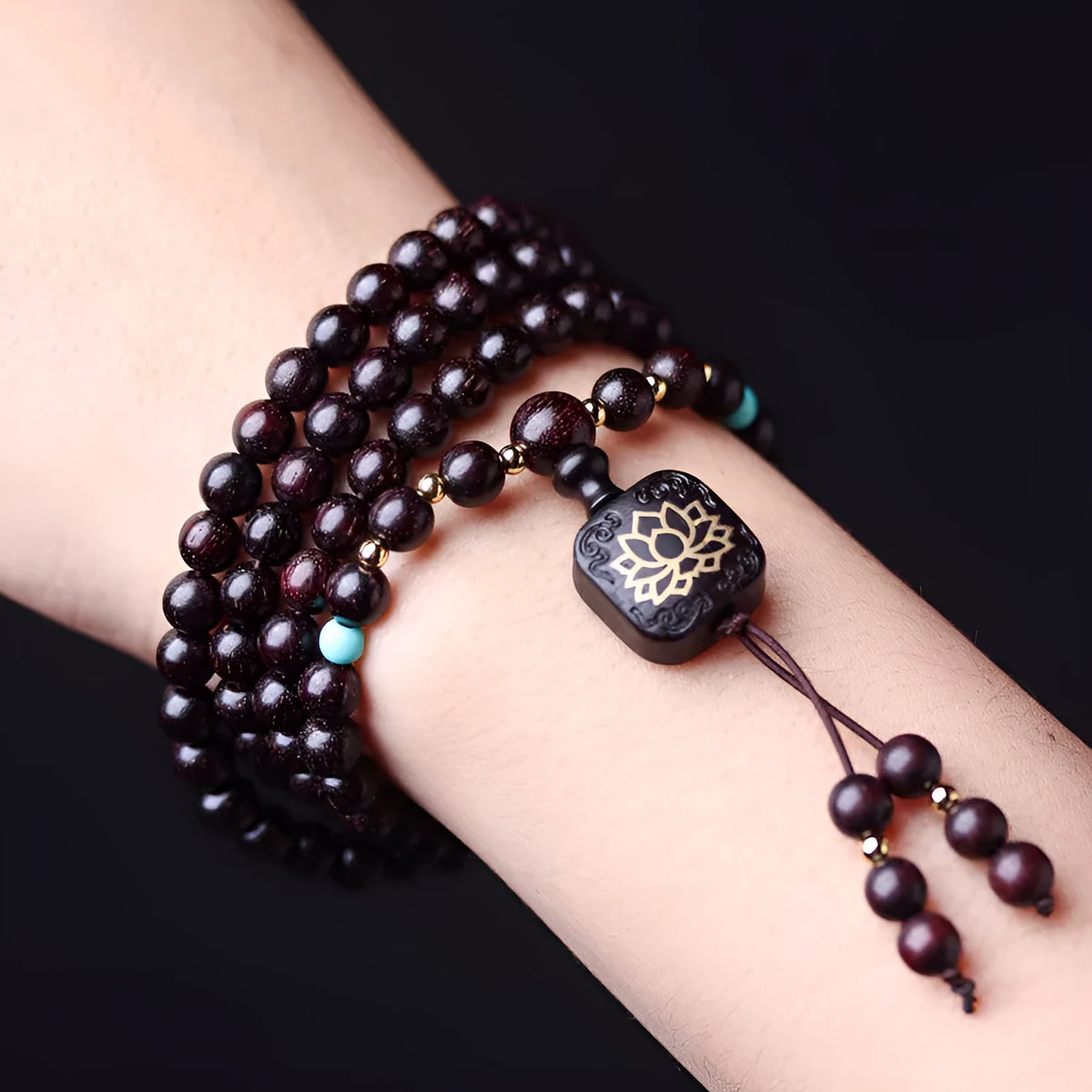 Zambian rosewood bead bracelet with flat lotus pendant showing 108 individual 0.6cm wooden beads