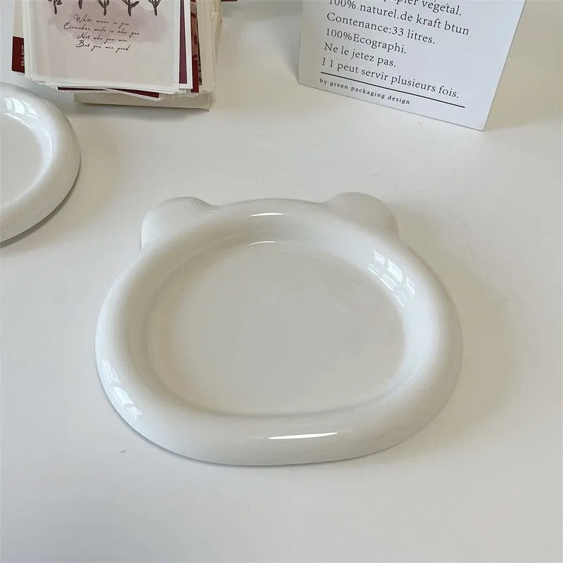 White ceramic plate with chubby toot bear illustration, porcelain potted tray.