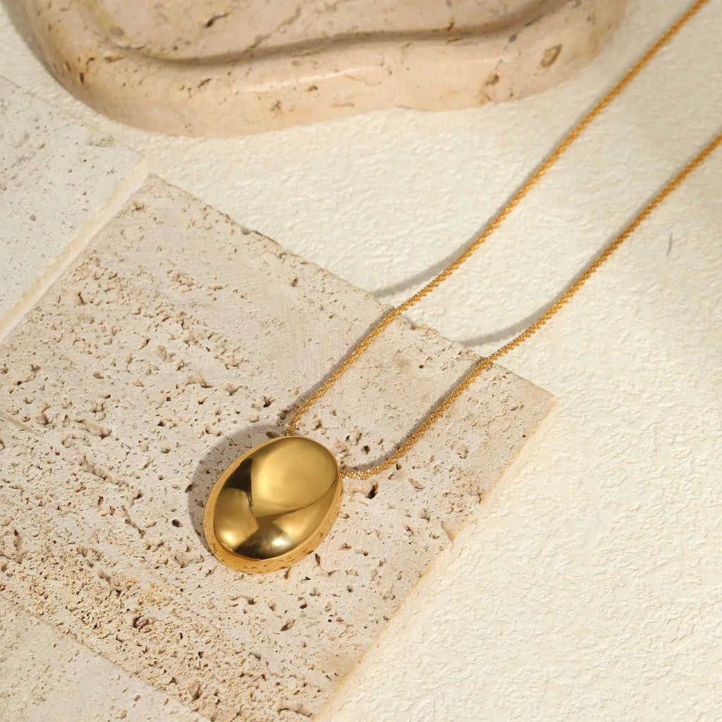Gold geometric pendant necklace on adjustable 41-50cm chain, stainless steel with electroplated finish