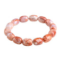 Natural cherry agate barrel bead bracelet with Ruyi elements measuring 10x14mm