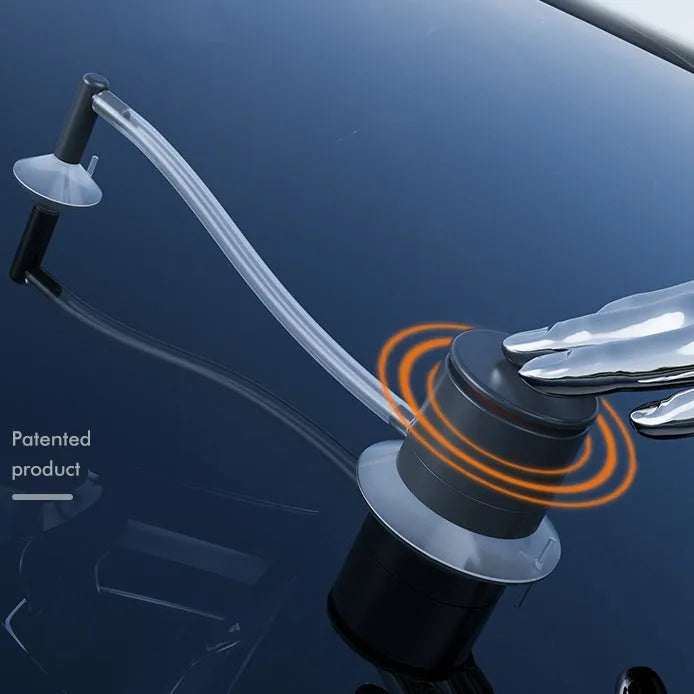 Plastic car windscreen crack repair tool and DIY stone chip repair kit on a flat surface.