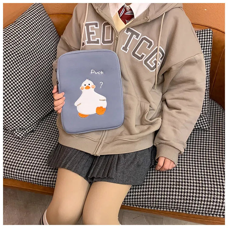 Blue cotton tablet case with cartoon duck embroidery and a zip closure, sized for an 11-inch tablet.