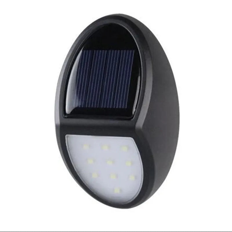 Black rectangular solar-powered LED wall light with solar panel on top.