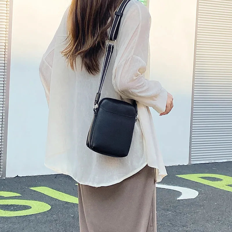 Small solid colour PU leather crossbody shoulder bag for women in beige, black, green, or khaki.