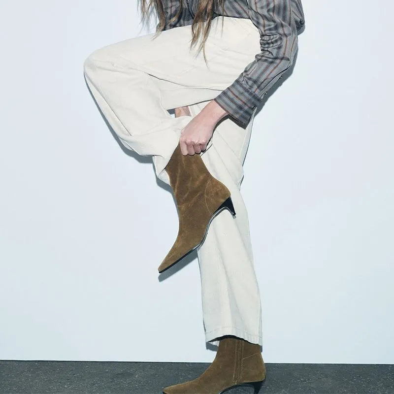 Brown square toe ankle boots with side zip and a mid stiletto heel on a waterproof platform sole.