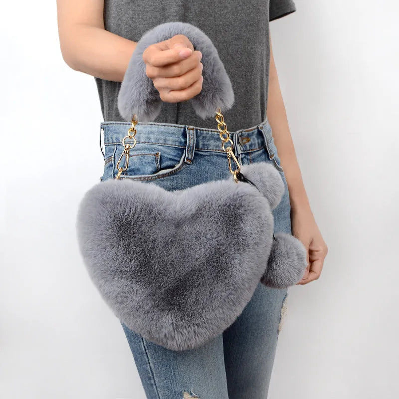 Medium sized soft plush heart-shaped women's handbag in a choice of fourteen colours with a synthetic leather lining