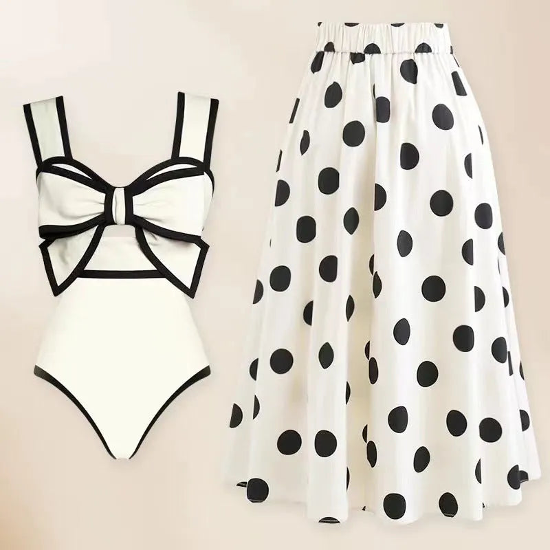 Women's black one-piece swimsuit with white bow and skirt for swimming