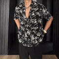 Loose-fitting printed casual shirt with floral pattern and short sleeves in black or white