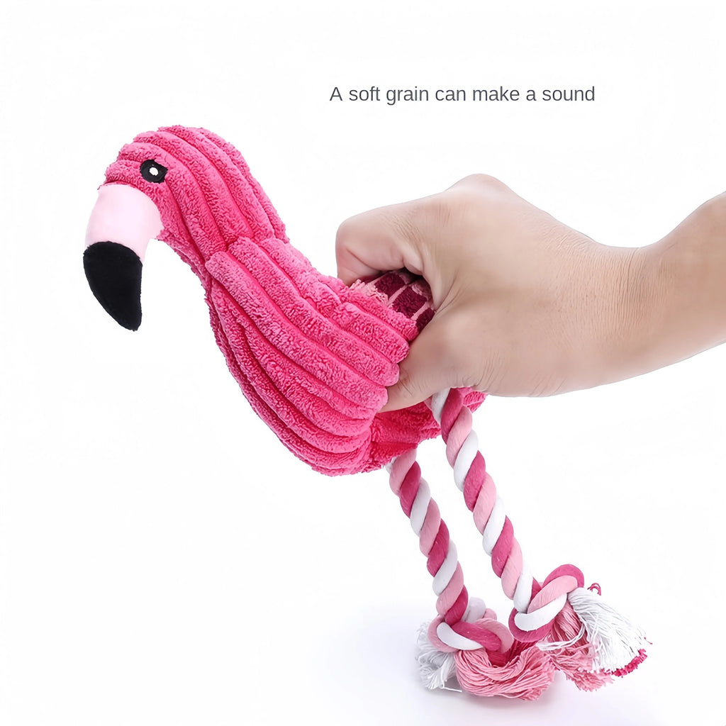 Pink animal-shaped corduroy plush dog toy with squeaker on a white background