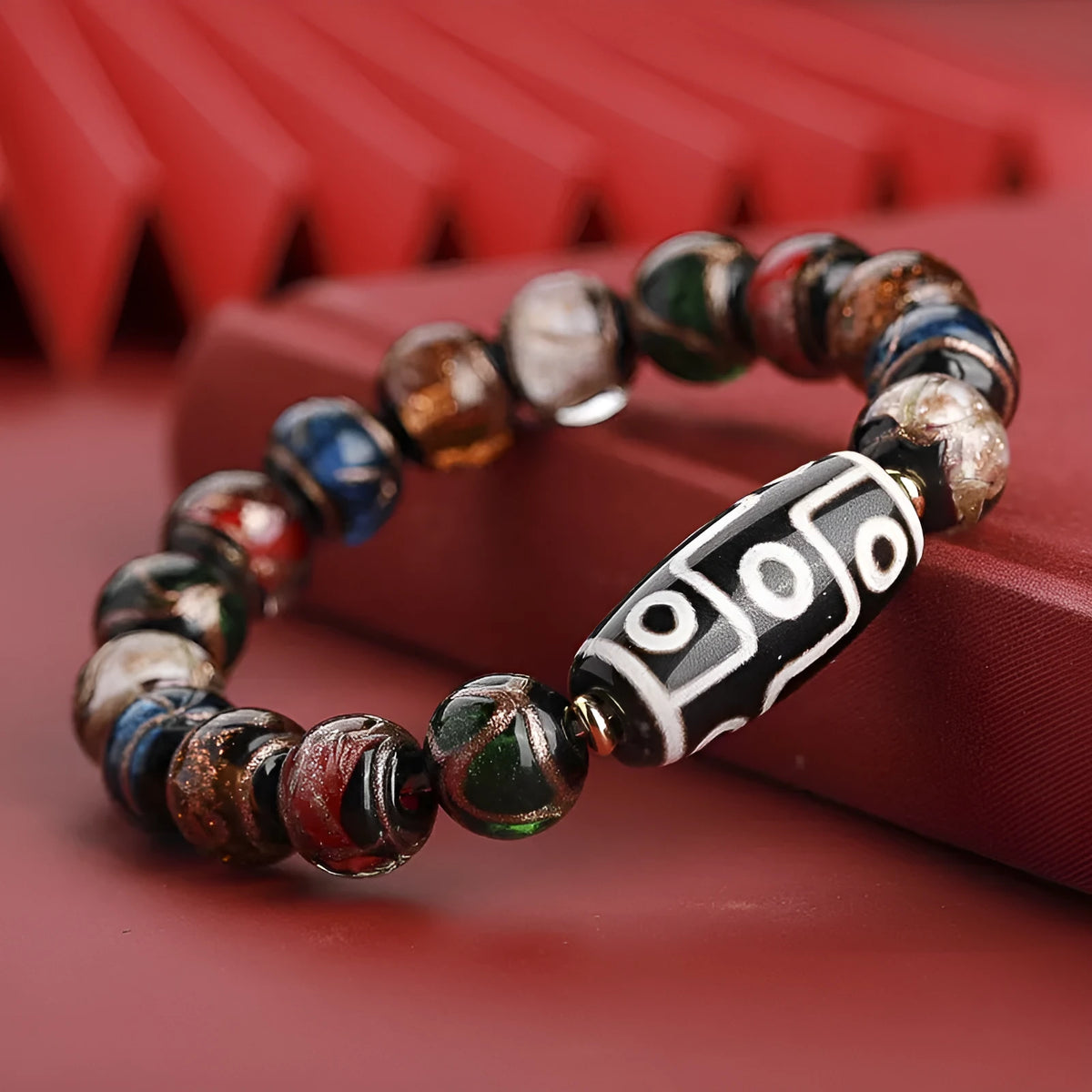 Handcrafted coloured glaze bracelet with Chinese auspicious patterns and snake beads in 10mm, 12mm, or 14mm sizes.