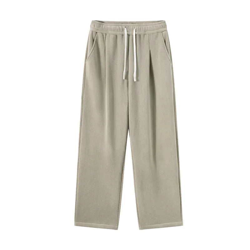 Men's apricot coloured loose-fit polar fleece winter trousers with a drawstring waist, shown flat.