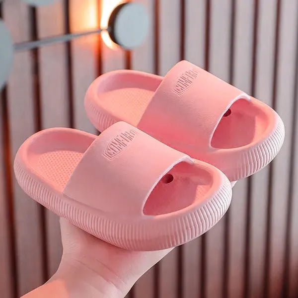 Children's mixed colour EVA slippers with non-slip soles showing 1.5cm thickness