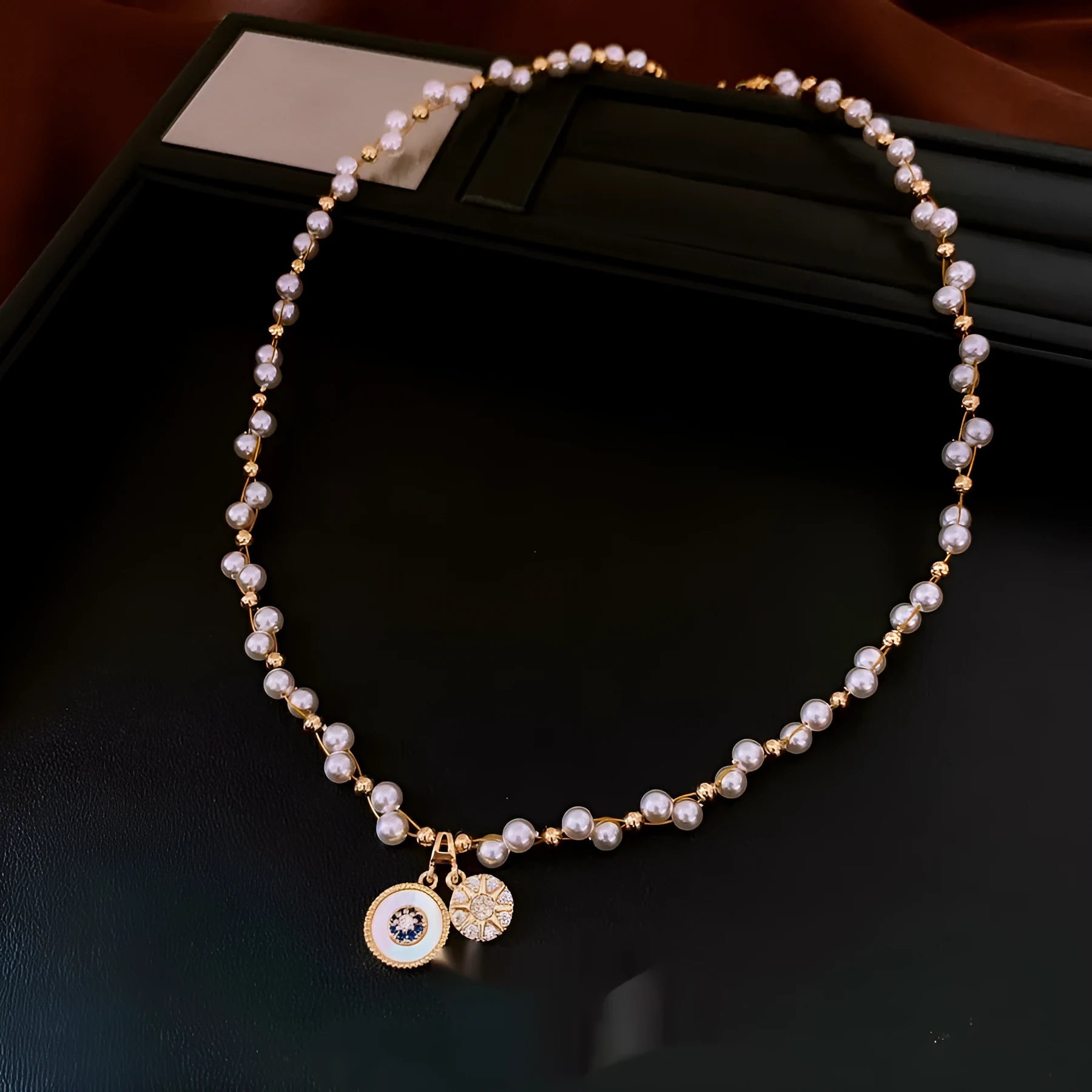 Gold electroplated round pendant necklace with inlaid zircon stone on a clavicle chain