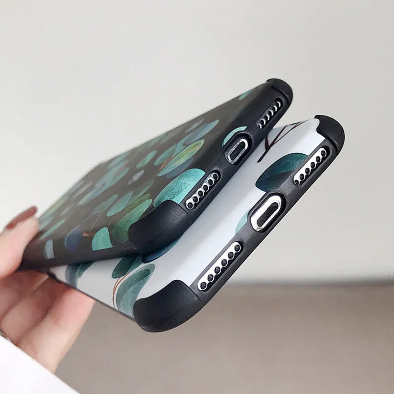 Black silicone iPhone case with a detailed raised leaf pattern design on the back.