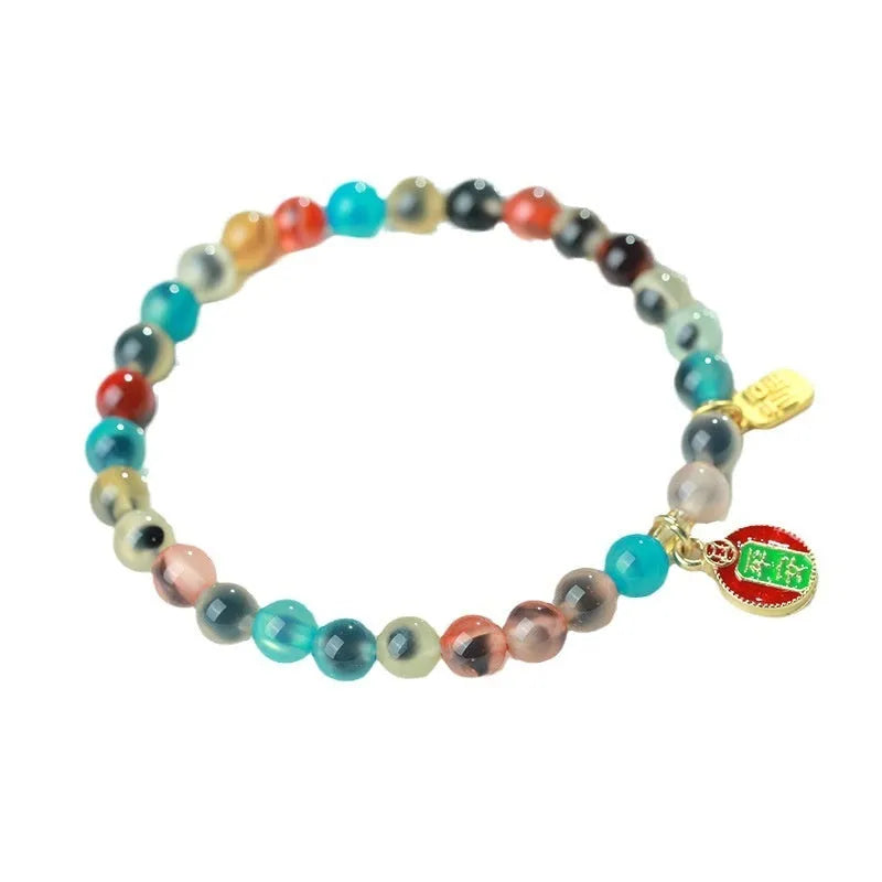 Women's agate snake bracelet with copper coin detailing and coloured glaze accents in geometric design