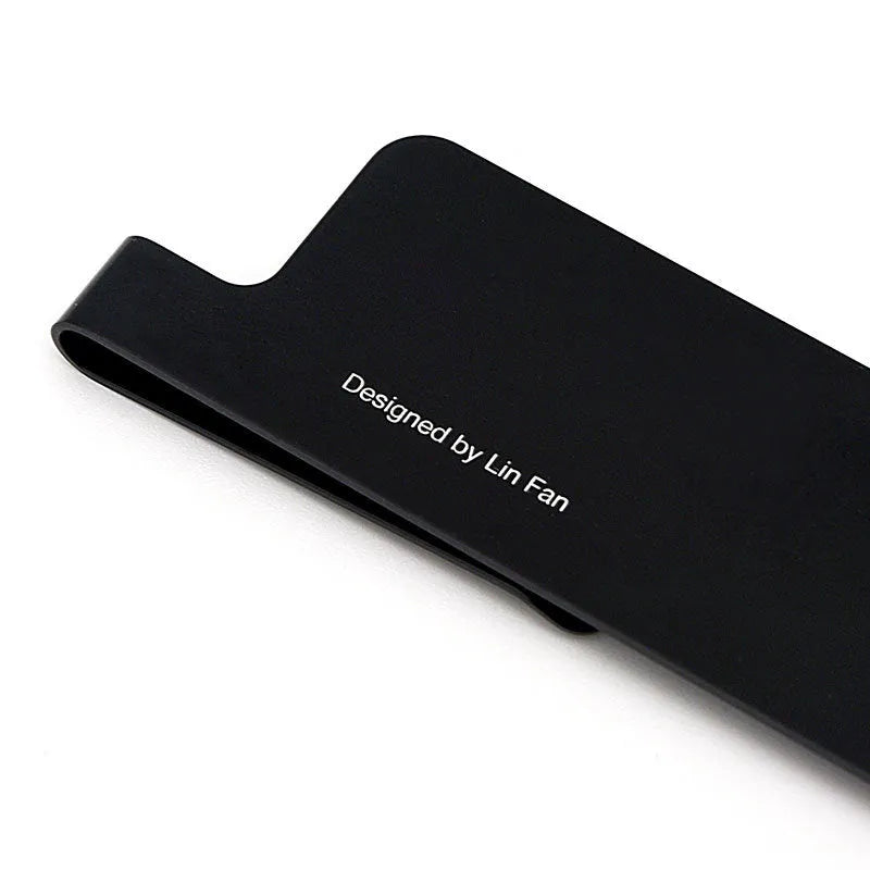 RUMA black aluminium ruler bookmark showing 15cm laser-engraved scale