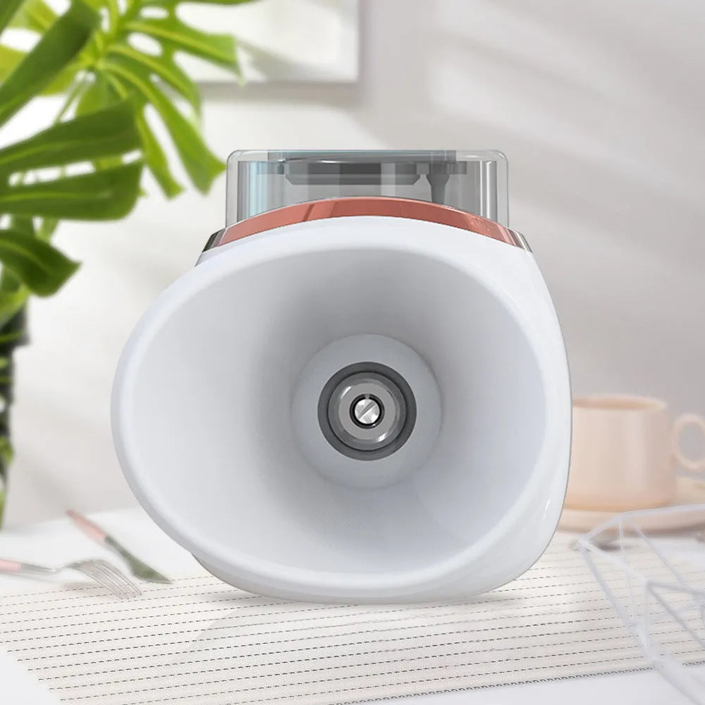 White portable eye humidifier with USB charging cable on a table