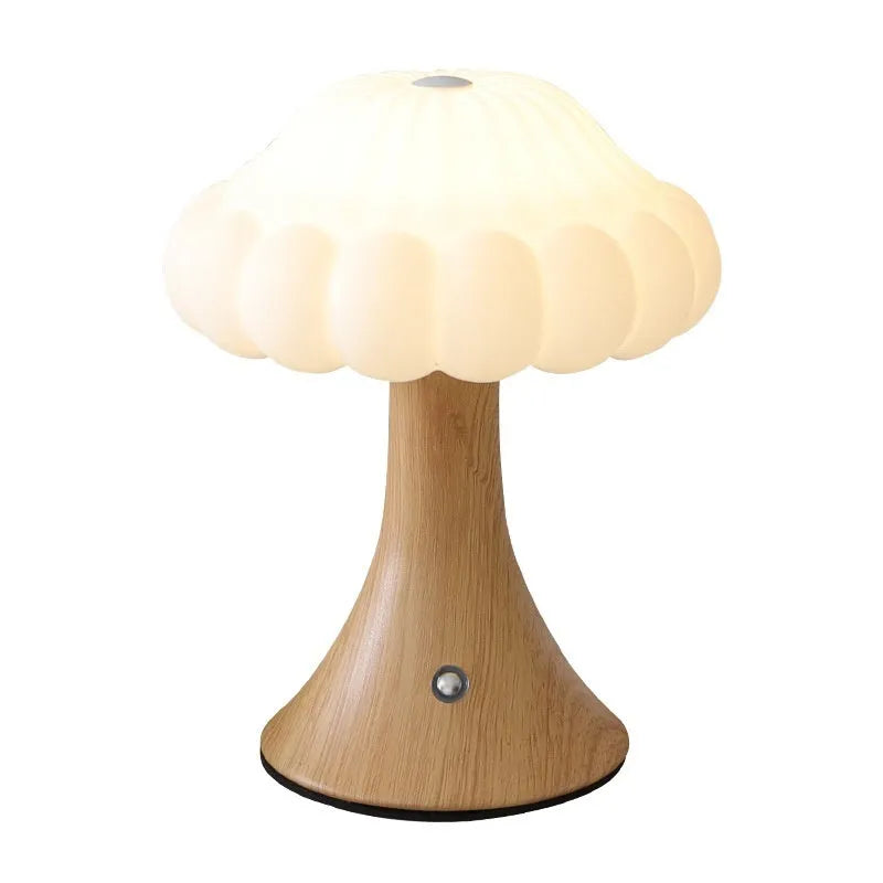 Mushroom-shaped touch control night lamp in wood grain colour on a table.