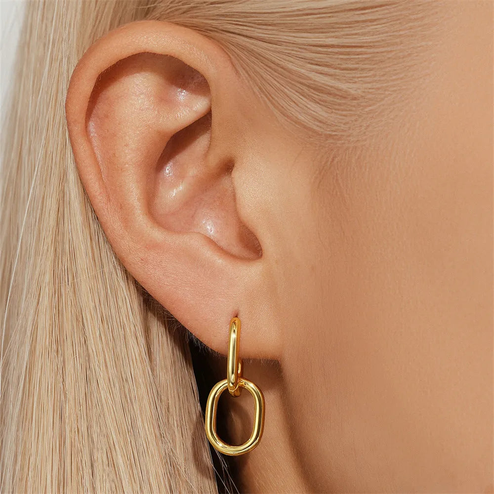Geometric brass earclip earrings with round design in gold electroplated finish