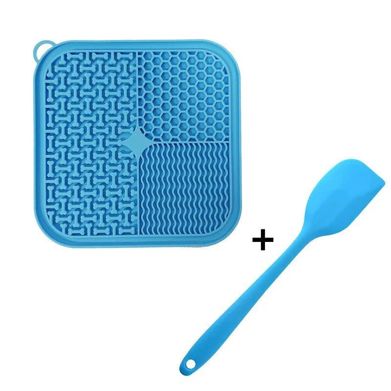 Orange red silicone dog licking mat with suction cups on back for slow feeding and anxiety relief