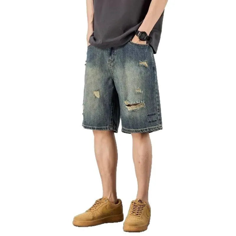 Blue retro distressed denim men's shorts with loose hole detailing and straight cut