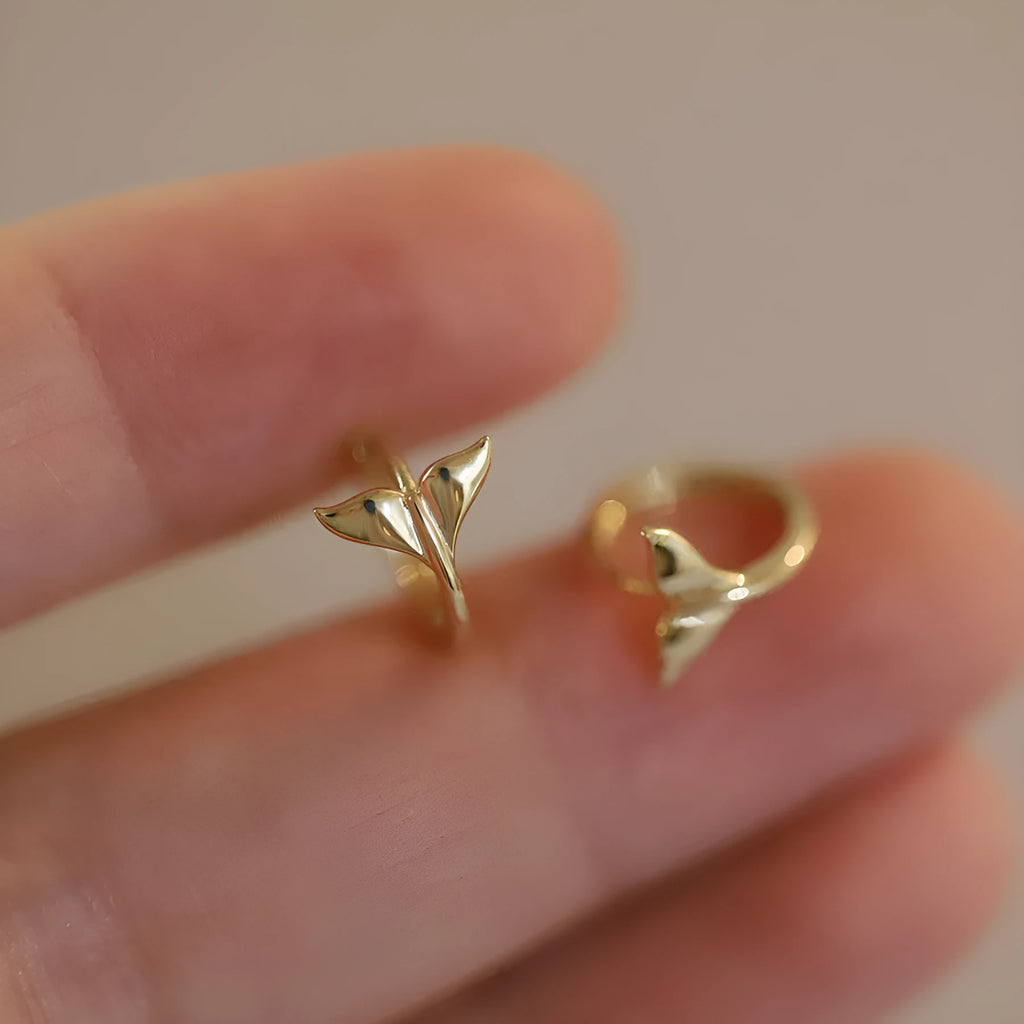 Gold plated sterling silver fish tail earrings for women, showing simple design and smooth finish.