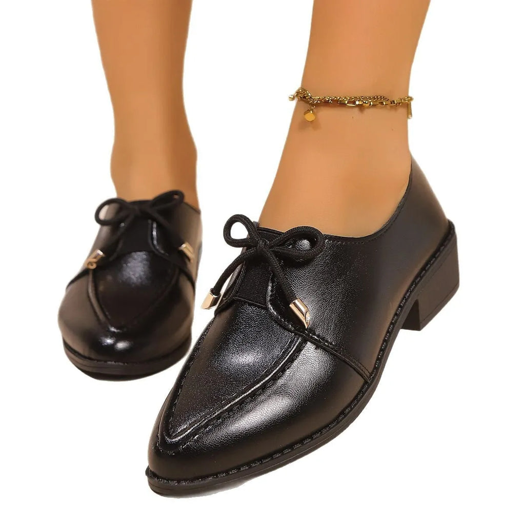 Women's simple leather shoes with bow decoration in British style, showing pointed toe and rubber sole
