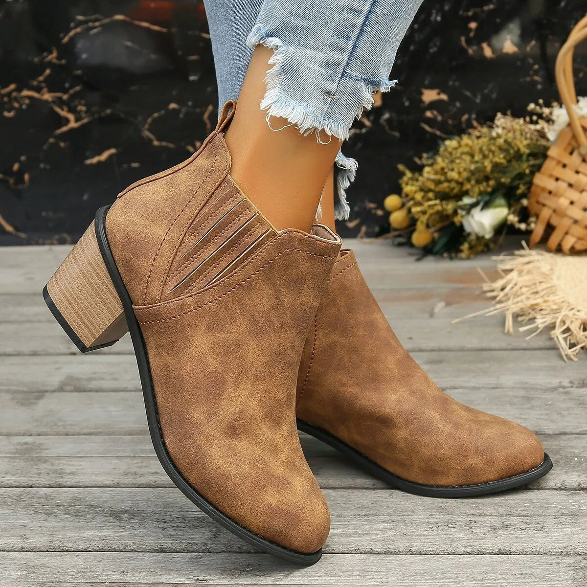 Women's black pointed toe ankle boots with thick square heel slip-on design
