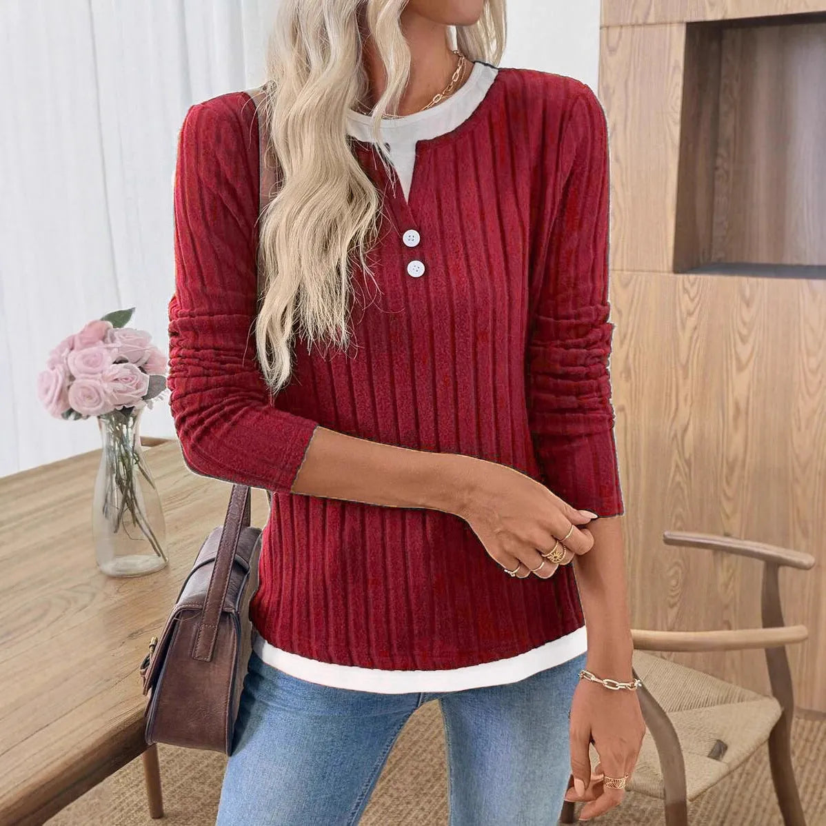 Women's fake two-piece pullover sweater with round neck, button details, and concave stripe pattern in solid colour