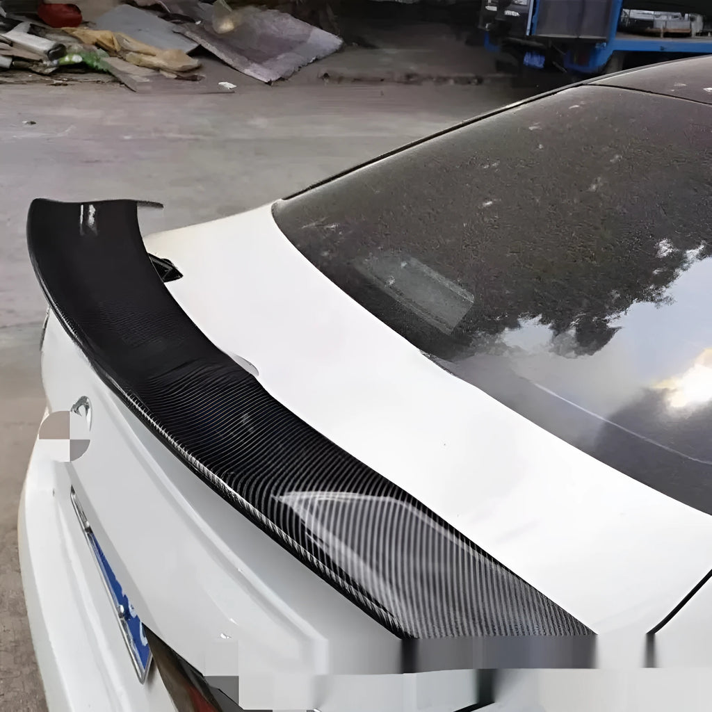 A bright black punch-free ABS plastic tail wing spoiler for cars.