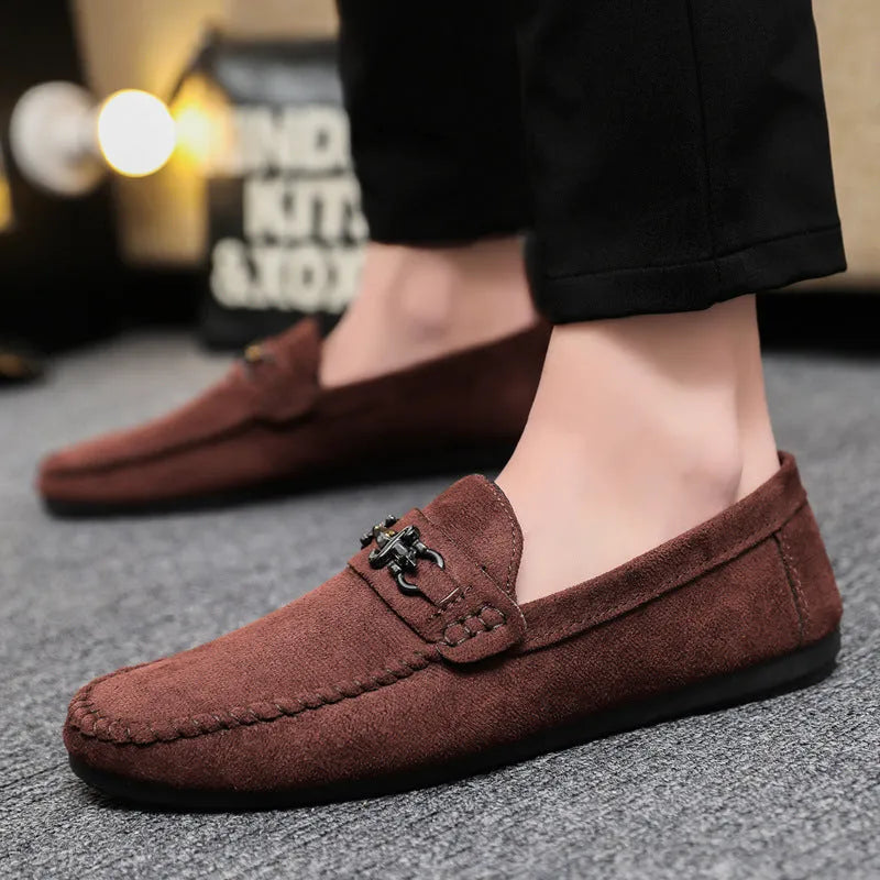 Men's black slip-on loafers with round toe and low heel on a white background