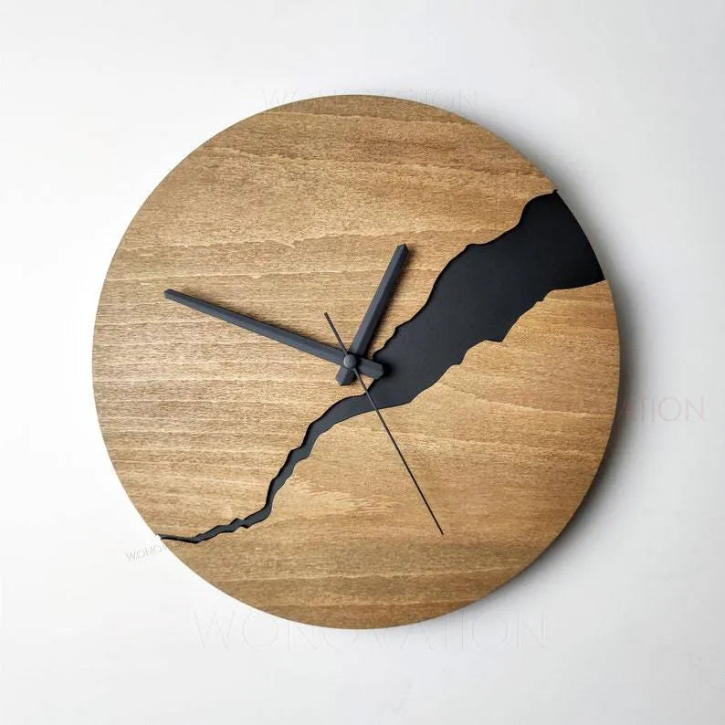 Modern wooden wall clock with a creative crack pattern design on its face, shown in one of five available colour options.