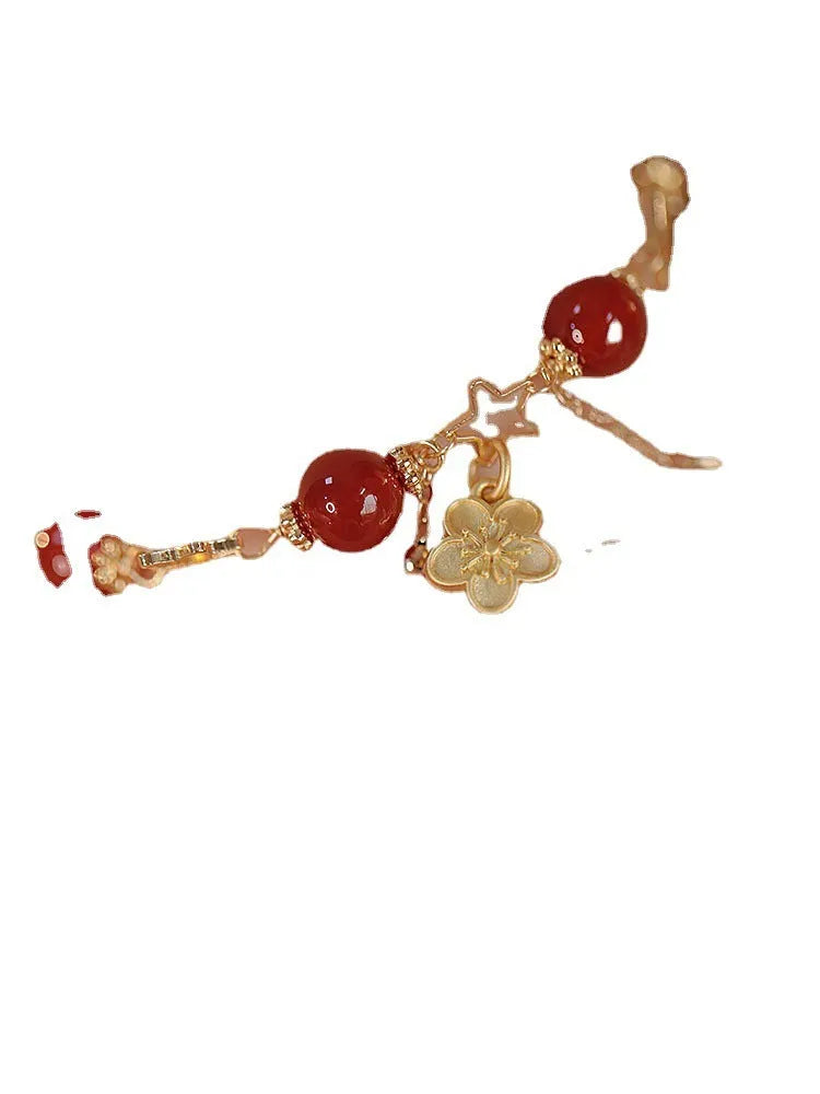 Red agate double layer women's bracelet with carved peach blossom and floral motifs.