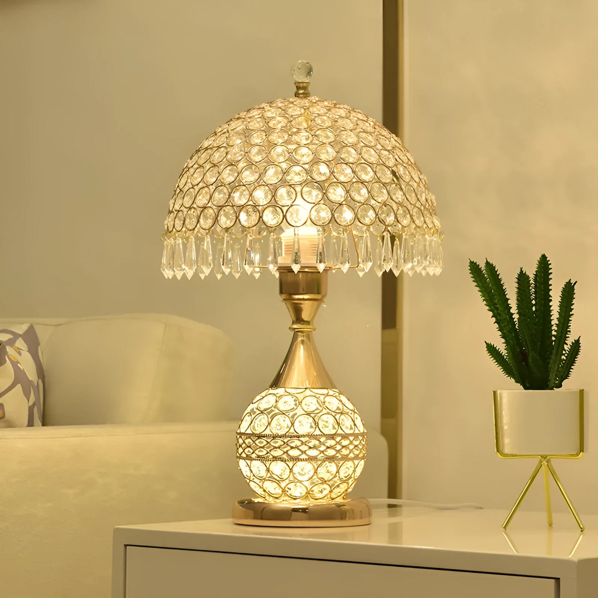 Gold crystal desk lamp with iron art base on wooden bedside table