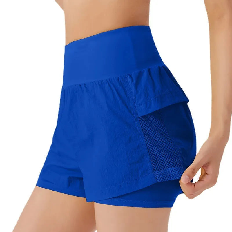 Women's loose-fit cotton blend quick-drying sports shorts in lemon yellow colour.